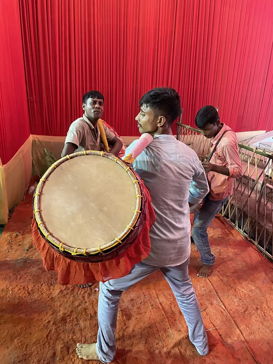 Dhakis playing the dhak at a Durga Puja.