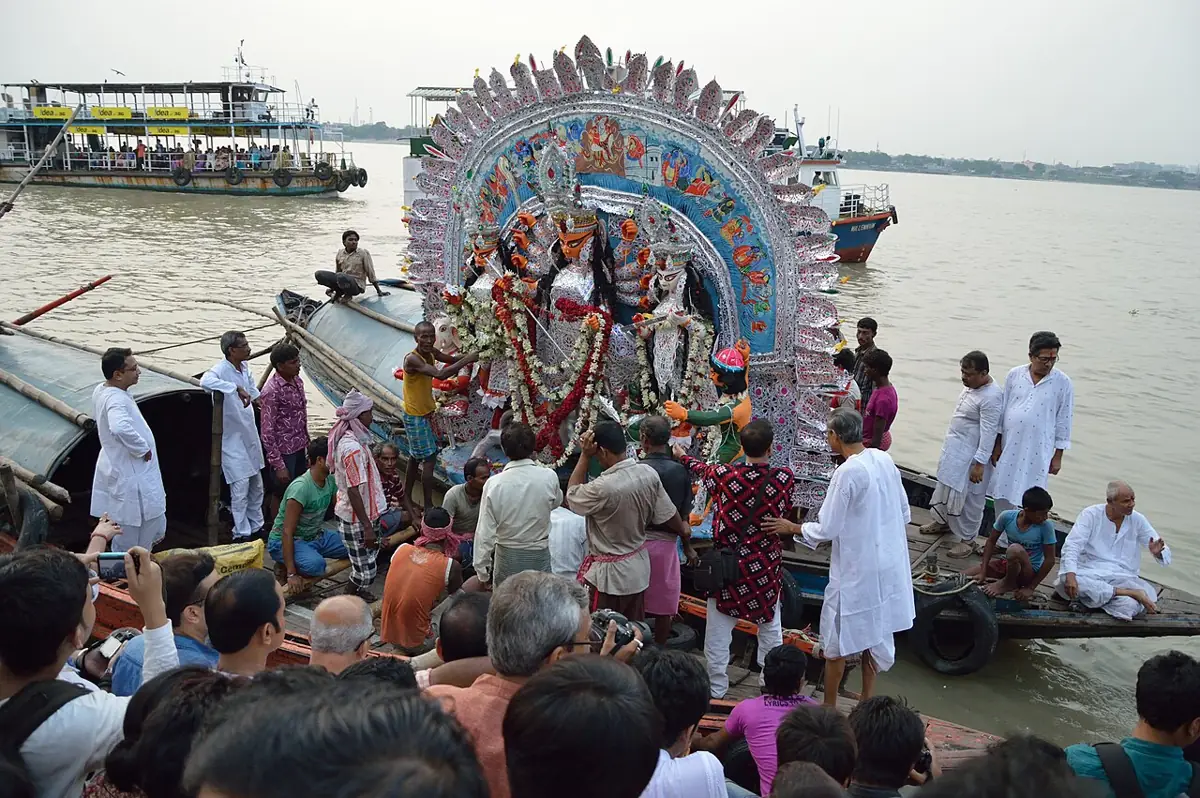 Sovabazar Rajbari's Durga is readied on boats at Baghbazar Ghat for immersion in the Hooghly.