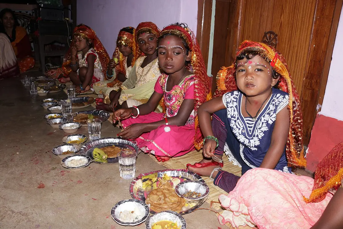 Girls are fed and honoured as the goddess in Kanya Pujan.