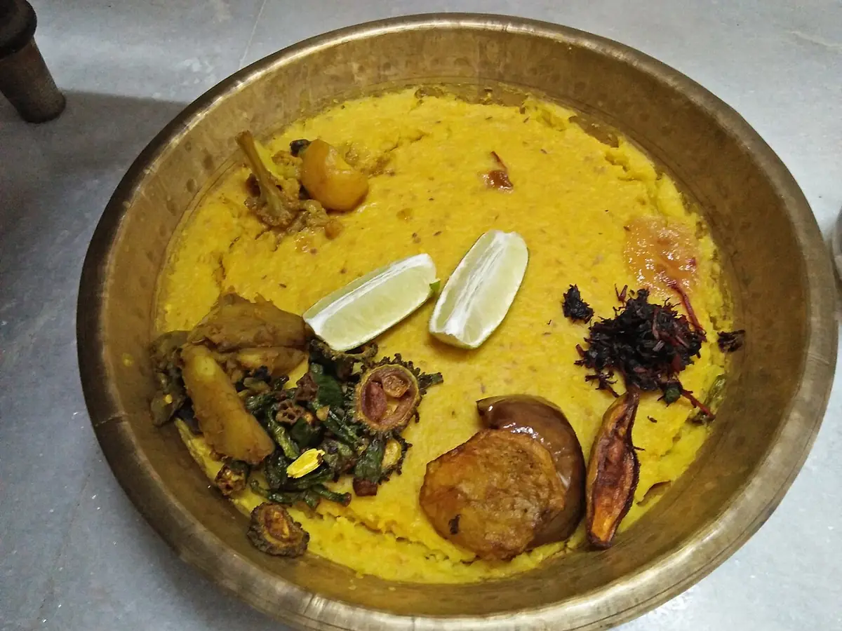Khichuri with fried vegetables, offered as bhog in a Bengali home.
