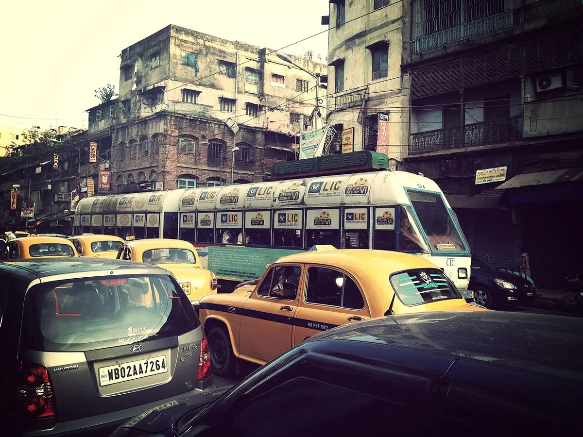 A Kolkata tram among yellow taxis.