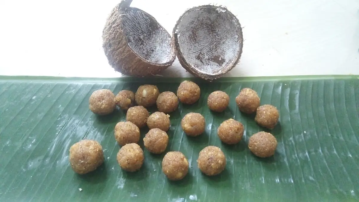 Narkel naru: coconut and jaggery sweets on a banana leaf.