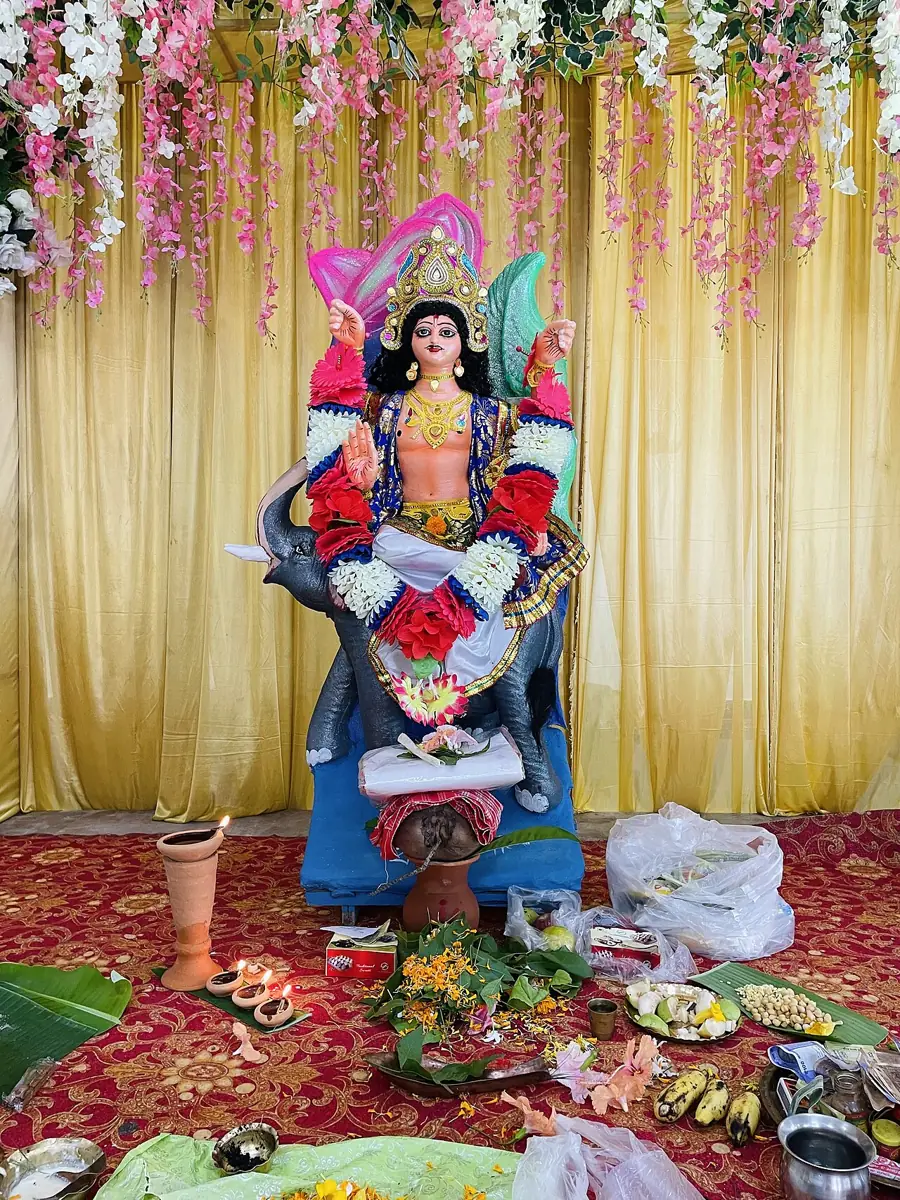 An idol of Vishwakarma, the divine architect, at a Vishwakarma Puja.